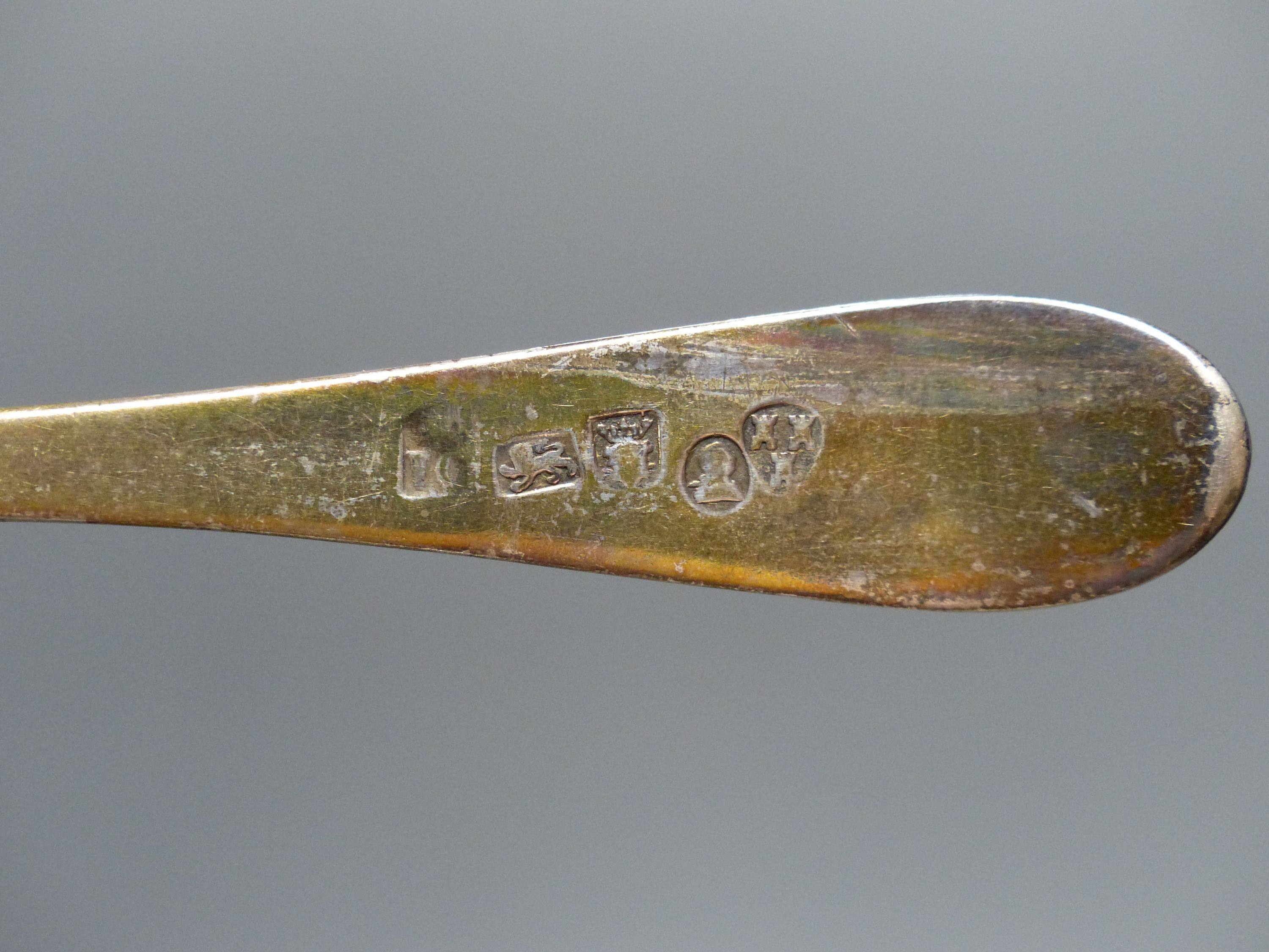 A Georgian Newcastle silver table spoon, three George III silver dessert forks and a later dessert spoons, 7oz.